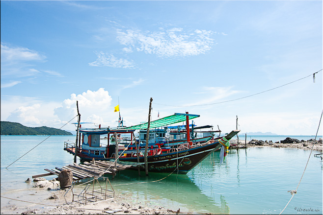 Thai fishing-style tourist boat with a rickety gangplank to the beach