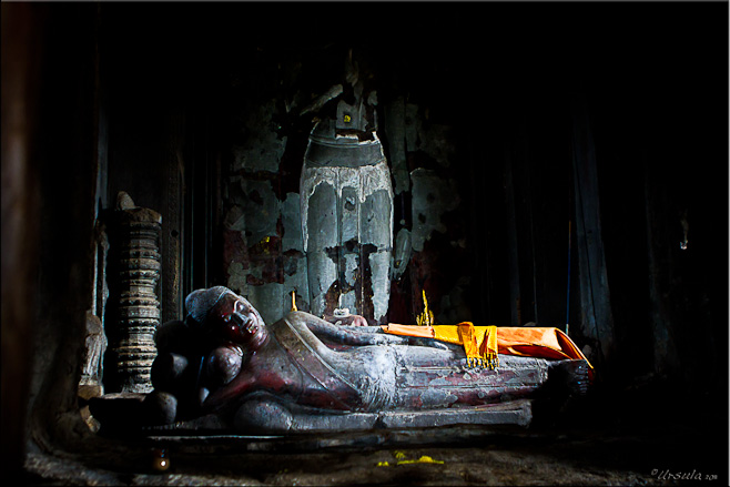 Reclining Buddha in a dark chamber: Angkor Wat