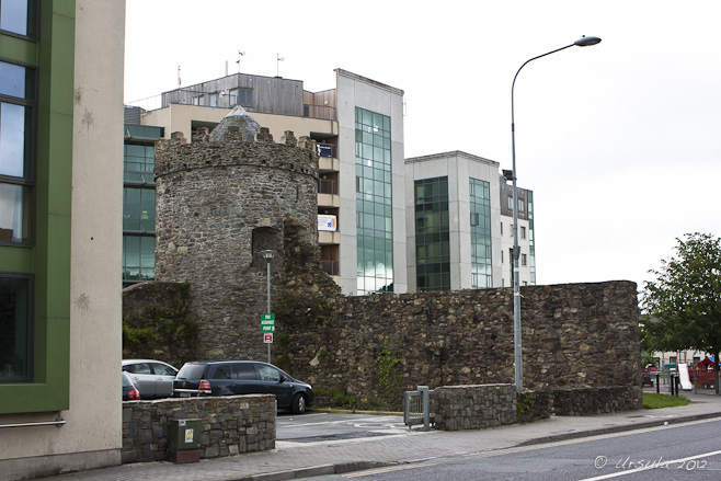 Viking wall-tower against modern buildings