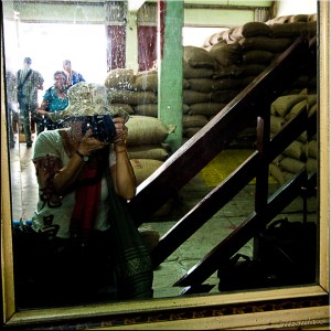 Self-protrait in a peanut warehouse window.