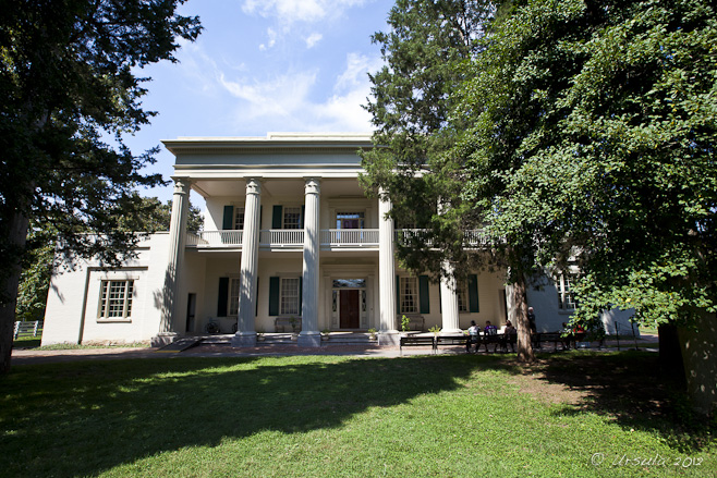 Greek columns at the front of the two story Hermitage Mansion.