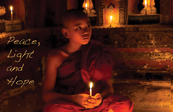 Peace Light and Hope: Novice Burmese monk holding a candle in a candle-lit space.