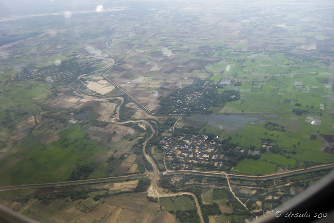 Green fields and muddy river: Aerial view of Mandalay region, Myanmar