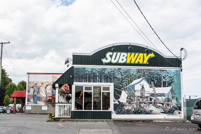 A Subway shopfront painted in with a mural on wooden housing, Chemainus, BC 