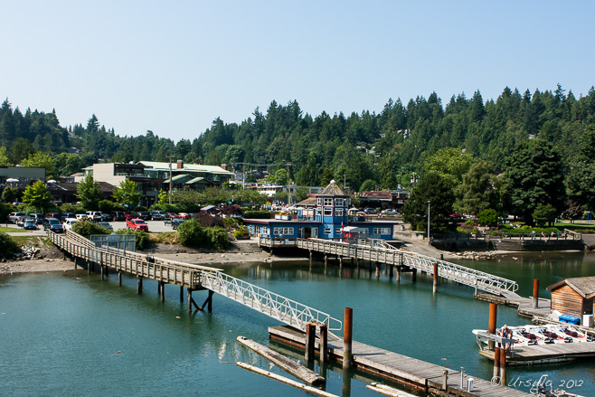 Looking back over the green waters and blue skies at Horseshoe Bay Ferry Terminal, BC Canada