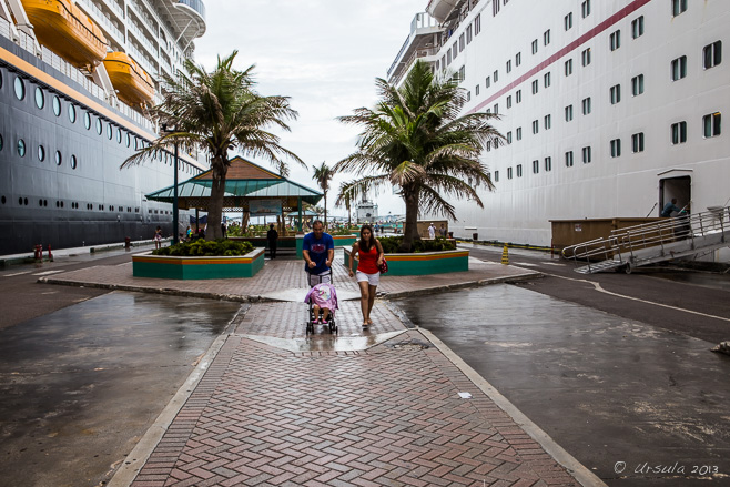 Family with a stroller in the Rain, Prince George Wharf, Nassau