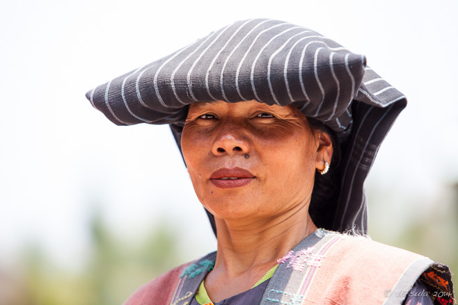 Portrait of a Toba Batak Woman in traditional headdress, Huta Bolon Simanindo, Lake Toba Sumatra
