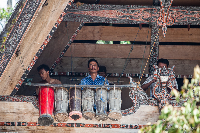 Toba Batak Musicians playing in the upper level of a Batak house, Huta Bolon Simanindo, Lake Toba Sumatra