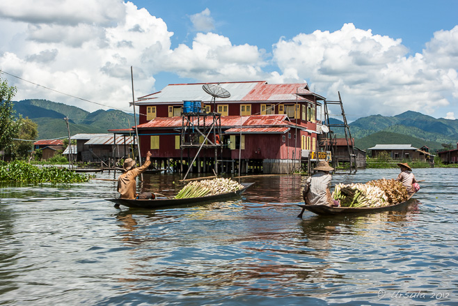 Two wooden boats laden with produce, Inle Lake Myanmar