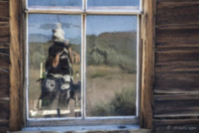 Reflection of a photographer in a wobbly window, Bodie State Historic Park,