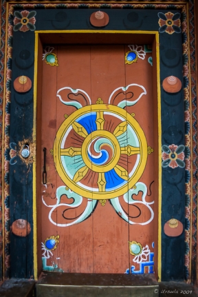 Door painted with Buddhist Wheel within a Wheel, , Punakha Dzong, Bhutan