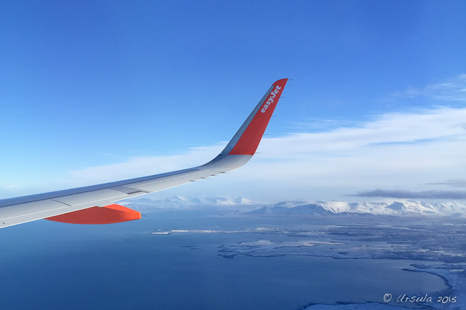 Orange EasyJet wing over a white snowy landscape, Iceland