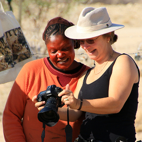 Photographer and Damara Woman in ochre, Namibia