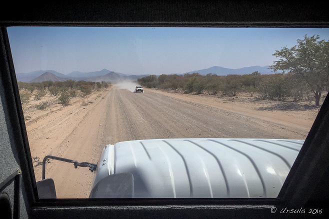 View of a gravel road from a truck window, Kunene Namibia