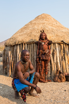 A Himba couple outside their hut, Kunene Region Namibia