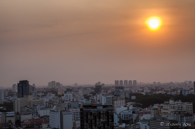 View over Ho Chi Minh from the rooftop bar at Sheraton Saigon Hotel as the sun sets, Vietnam