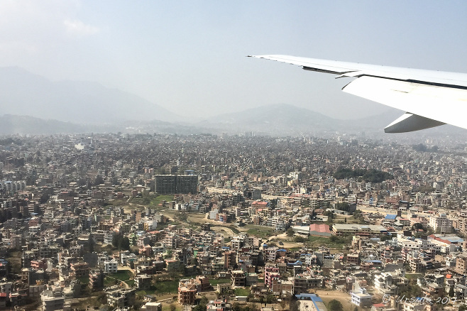 Airplane wing over Kathmandu, Nepal