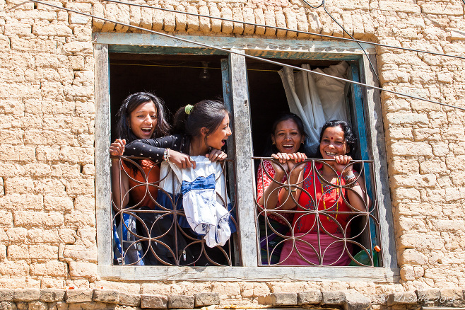 Four Nepali women in a window, Panauti-Namobuddha Rd, Nepal