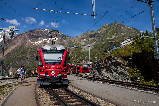 Red Bernina Express train in Alp Grum Station, Switzerland