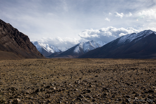 A Lanscape of Rocks with Altai Mountains in the distance, Bayan-Ölgii, Mongolia