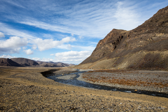 A Lanscape of Rocks with a shallow river in the distance, Bayan-Ölgii, Mongolia