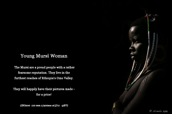 Underexposed bright-rim-light picture of a young Mursi woman, Ethiopia
