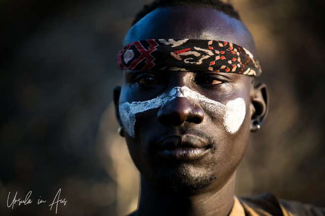 Mursi man in a headband and face paint, Ethiopia