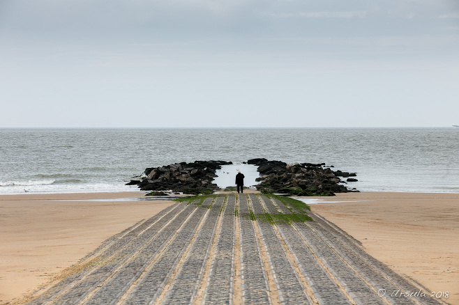 A man in an overcoat, Bathing Pool Access, Knokke, Belgium