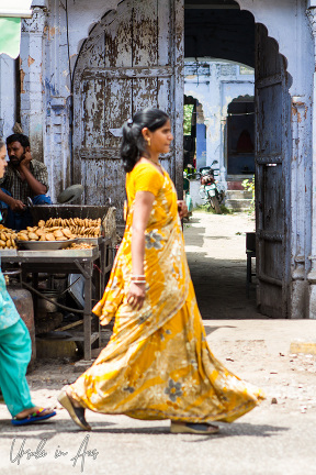 Indian woman in a yellow sari, Haridwar, India