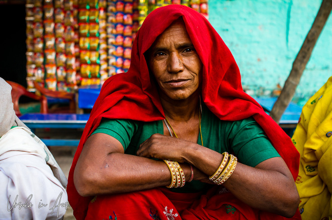 Portrait: Indian woman in a red Ghoonghat, Haridwar.