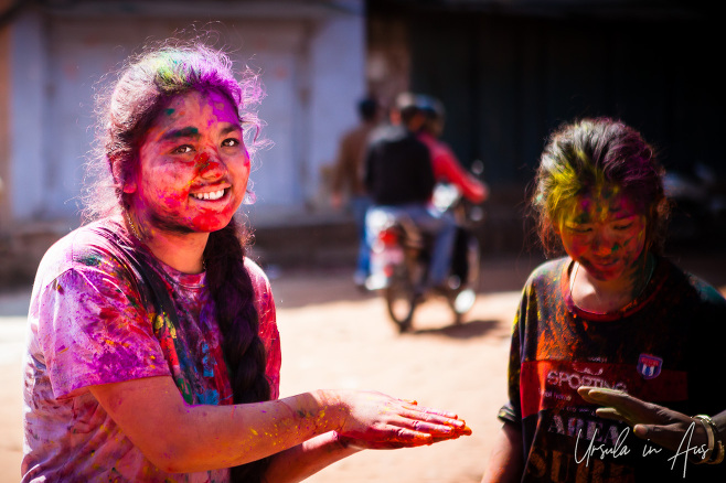 Young Nepali woman in coloured face powder, Bhaktapur.