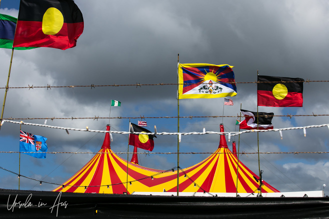 National and Indigenous flags against the Delta tenttop, Boomerang Festival, Byron Bay Australia