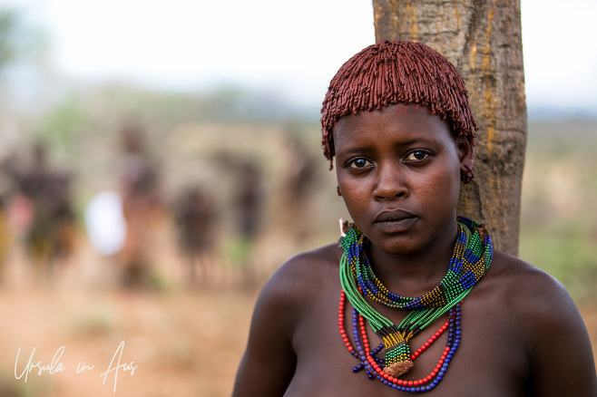 Portrait: Young Hamar woman in beads and ochre, Ethiopia