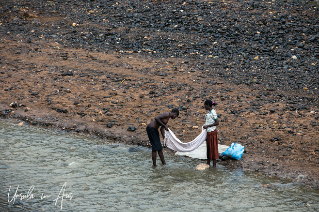 Women doing laundry in the river, Stephanie Wildlife Sanctuary, Ethiopia