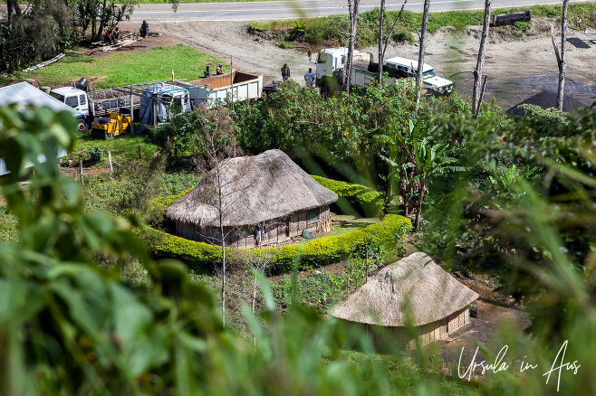 Thatched houses and big trucks, Paiya Village Papua New Guinea
