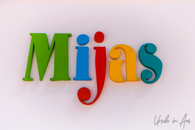 Town logo on a white wall, Mijas Tourism Office, Spain 