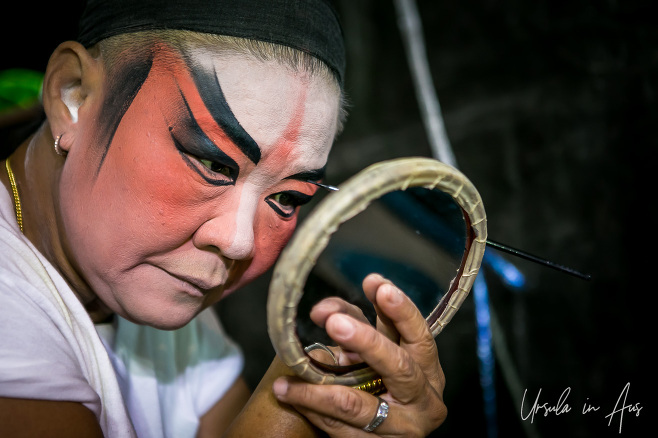 Portrait: A man applying Chinese Opera makeup, Chinatown, Bangkok Thailand