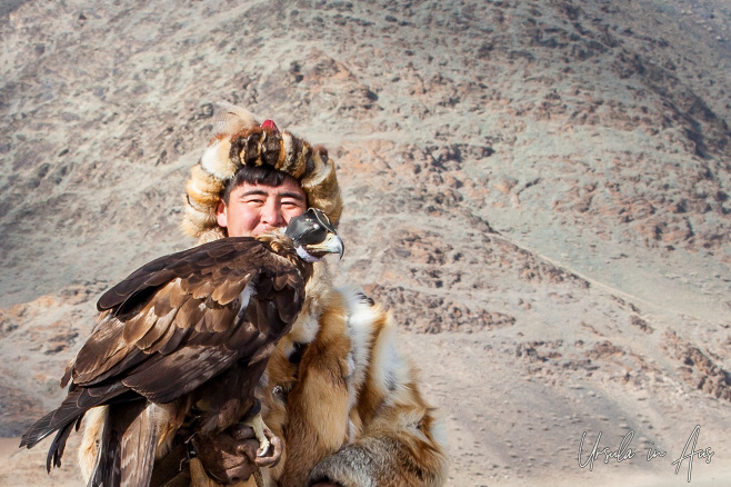 Portrait: Kazakh Hunter and his bird at the Golden Eagle Festival, Olgii Mongolia