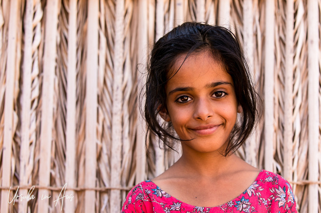 Portrait of a smiling Bedouin girl, Wahiba Sands, Oman