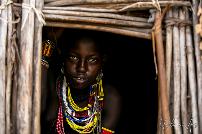 Portrait of an Arbore woman in her doorway, Omo Valley Ethiopia