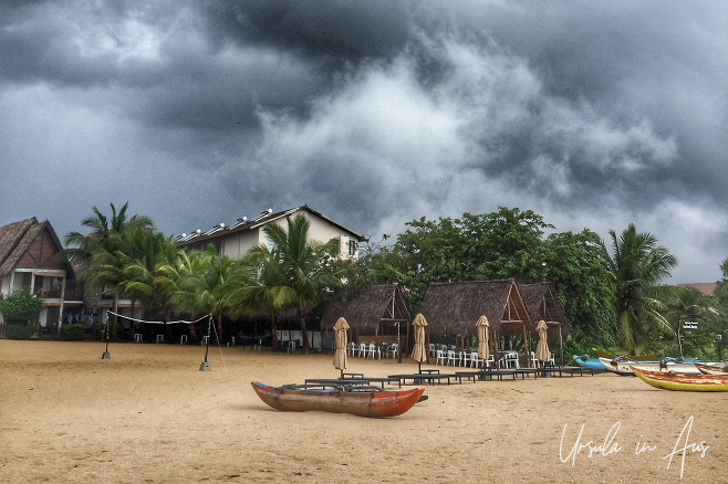 Traditional boat on a rainy Pasikuda Beach, Sri Lanka