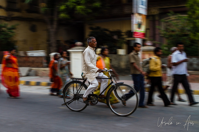 Bicycle on the move against blurry walking people, Haridwar India