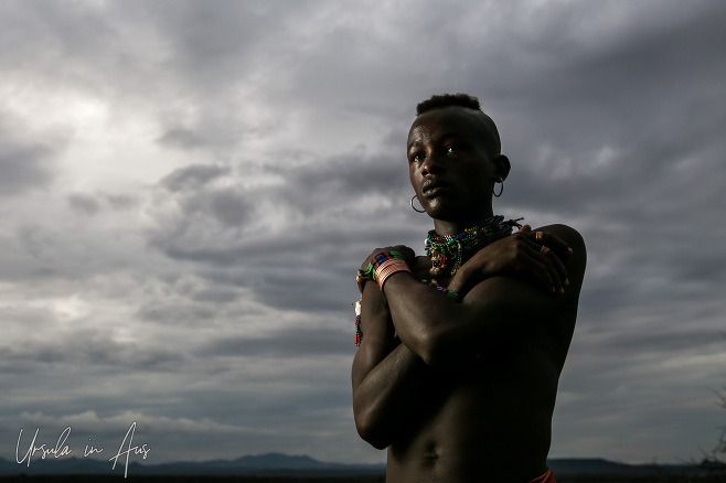 Young Hamar man against a dark sky, Omo Valley Ethiopia