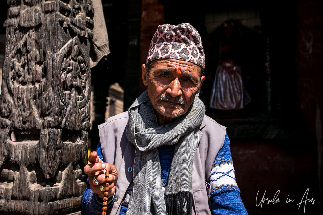 Nepali man with prayer beads, Royal Palace, Patan Nepal