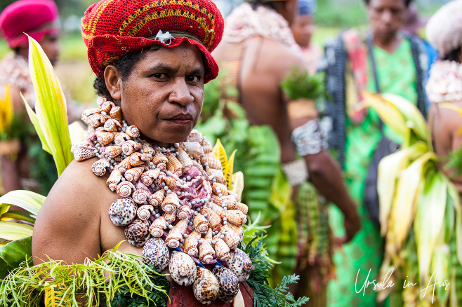 Portrait: Western Highland Papuan Woman in a bilum hat ans shell necklace.