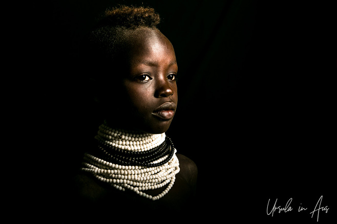 Portrait: Kara Youth in white and black beads, Dus Village, Ethiopia