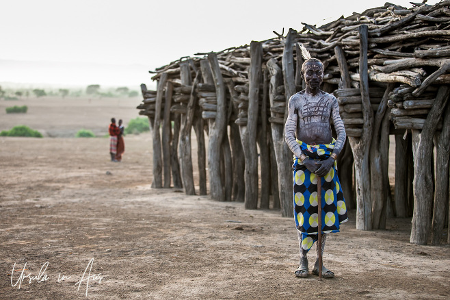 A Kara elder in front of the Ceremony House, Omo Valley, Ethiopia