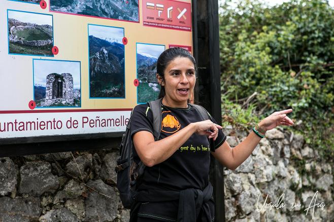 A Spanish guide in front of an explanatory sign board, Alevia, Spain