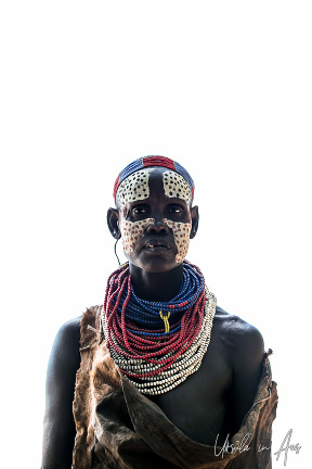 Woman in guinea fowl face paint, Omo River Ethiopia