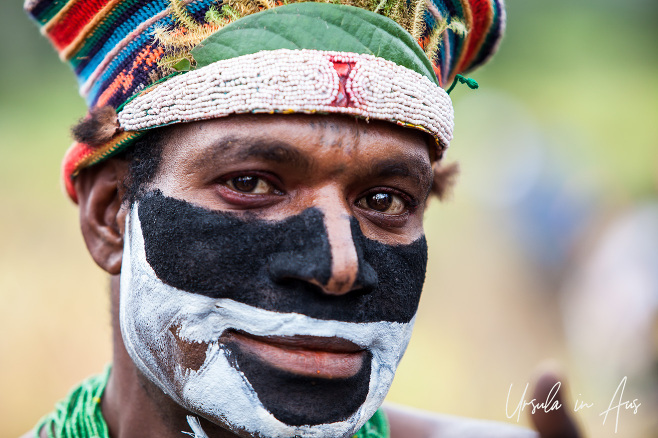 Portrait: Western Highlands man in partial face paint, Mt Hagen Cultural Show, PNG